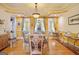 Elegant dining room features beautiful trim work, pendant lighting, and bay windows at 7523 Kimberly Lynn Ct, Lithonia, GA 30058