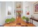 Grand two-story foyer with hardwood floors, decorative niches, and views into the formal dining area at 7523 Kimberly Lynn Ct, Lithonia, GA 30058