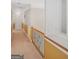 Second floor hallway with railing and decorative paint scheme at 7523 Kimberly Lynn Ct, Lithonia, GA 30058