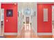 Elegant hallway with high ceilings, bright walls, and a view of the front door at 7523 Kimberly Lynn Ct, Lithonia, GA 30058