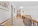 Upstairs hallway with wooden railing overlooking lower level at 7523 Kimberly Lynn Ct, Lithonia, GA 30058