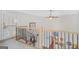Hallway with wooden railings, natural light, and staircase at 7523 Kimberly Lynn Ct, Lithonia, GA 30058