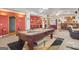 Large recreation room with a pool table, seating, and a bar area, great for entertaining at 7523 Kimberly Lynn Ct, Lithonia, GA 30058