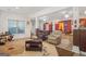 Expansive recreation room with diverse seating options, a wet bar, and ample space for activities at 7523 Kimberly Lynn Ct, Lithonia, GA 30058