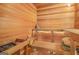 A cedar sauna room with wooden benches and a heater showcasing a relaxing amenity at 7523 Kimberly Lynn Ct, Lithonia, GA 30058