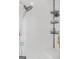Walk-in shower with shower head and corner shelving at 7523 Kimberly Lynn Ct, Lithonia, GA 30058