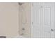 Shower featuring neutral tile, handheld shower head, and chrome faucet and shower controls at 7523 Kimberly Lynn Ct, Lithonia, GA 30058