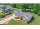 Beautiful single-story home with stone accents, mature trees, and a well-maintained lawn at 90 Heatherstone Way, Covington, GA 30016