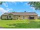 View of the back of the home, showcasing the backyard, patio, and exterior siding at 90 Heatherstone Way, Covington, GA 30016
