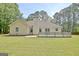 Lush backyard features a charming deck, perfect for outdoor enjoyment and entertaining with a well-manicured lawn at 15 Riverside Pkwy, Sharpsburg, GA 30277