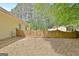Backyard scene with a wooden gate and fence, offering privacy and security, framed by lush greenery at 15 Riverside Pkwy, Sharpsburg, GA 30277