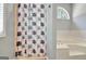 Bathroom featuring bathtub, commode, and a shower with privacy curtain at 15 Riverside Pkwy, Sharpsburg, GA 30277