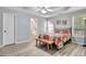 Calming bedroom boasts a ceiling fan and natural light with access to the bathroom at 15 Riverside Pkwy, Sharpsburg, GA 30277