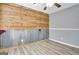 A charming bedroom with a ceiling fan features an industrial-style accent wall at 15 Riverside Pkwy, Sharpsburg, GA 30277