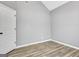 A simple bedroom features light gray walls and wood-look flooring at 15 Riverside Pkwy, Sharpsburg, GA 30277