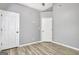 A bright bedroom with wood-look flooring has two closets and a ceiling fan at 15 Riverside Pkwy, Sharpsburg, GA 30277
