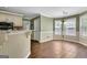 Sunlit breakfast nook with beadboard trim and large windows for enjoying morning meals at 15 Riverside Pkwy, Sharpsburg, GA 30277