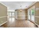 Bright dining area features french doors, a modern chandelier, and an entrance to the breakfast nook at 15 Riverside Pkwy, Sharpsburg, GA 30277