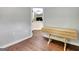 Hallway with view into the kitchen, wainscoting, and wood floors at 15 Riverside Pkwy, Sharpsburg, GA 30277