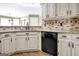 Cozy kitchen with granite countertops, stainless steel appliances, and decorative backsplash at 15 Riverside Pkwy, Sharpsburg, GA 30277