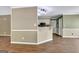 View of open kitchen area with white cabinets and a breakfast bar at 15 Riverside Pkwy, Sharpsburg, GA 30277