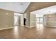 Bright and airy living area with vaulted ceiling and open floor plan leading to dining and kitchen spaces at 15 Riverside Pkwy, Sharpsburg, GA 30277