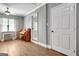 Inviting living area with hardwood floors, ceiling fan, and natural light from nearby window at 15 Riverside Pkwy, Sharpsburg, GA 30277