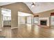 Inviting living room with vaulted ceiling, brick fireplace, and french doors leading to outdoor space at 15 Riverside Pkwy, Sharpsburg, GA 30277