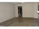 Unfinished basement with concrete floors and access to utilities at 214 Oak Cir, Stockbridge, GA 30281