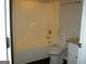 Standard bathroom with a shower-tub combo, toilet, and granite counter at 214 Oak Cir, Stockbridge, GA 30281