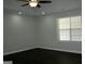 Bedroom featuring vinyl floors, ceiling fan and a window at 214 Oak Cir, Stockbridge, GA 30281