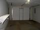 Two-car garage with shelving and garage door at 214 Oak Cir, Stockbridge, GA 30281