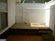 Private outdoor patio area with wooden deck and white privacy fence at 214 Oak Cir, Stockbridge, GA 30281
