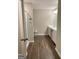 Bright bathroom featuring a double vanity, modern fixtures, and attractive wood-look floors at 6398 Lanier Harbor Lndg, Buford, GA 30518