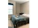 Comfortable bedroom with a serene ambiance and a large window for natural light at 6398 Lanier Harbor Lndg, Buford, GA 30518