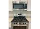Close up view of stainless steel oven and microwave appliances at 6398 Lanier Harbor Lndg, Buford, GA 30518