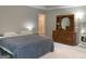 Spacious primary bedroom featuring carpet and views into the primary bath at 6398 Lanier Harbor Lndg, Buford, GA 30518