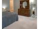 Spacious primary bedroom featuring carpet and views into the primary bath at 6398 Lanier Harbor Lndg, Buford, GA 30518