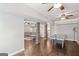 Entertaining basement area featuring an air hockey table, stone columns, and access to a cozy seating area at 68 Timber Creek Estates Dr, Sharpsburg, GA 30277