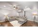 Spacious finished basement with recessed lighting, a sectional sofa, and durable hardwood flooring at 68 Timber Creek Estates Dr, Sharpsburg, GA 30277