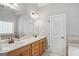 Bathroom features a double sink vanity with a large mirror, tub, and plenty of natural light at 68 Timber Creek Estates Dr, Sharpsburg, GA 30277