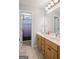 Bathroom with double vanity, wood cabinets, tile flooring, and a separate shower room for added convenience at 68 Timber Creek Estates Dr, Sharpsburg, GA 30277