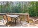 Outdoor deck with wood floors, railings, furniture, and a providing a peaceful setting at 68 Timber Creek Estates Dr, Sharpsburg, GA 30277