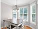 Cozy dining area with bay windows featuring hardwood floors and a chandelier at 68 Timber Creek Estates Dr, Sharpsburg, GA 30277