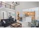 Bright and airy living room featuring an open floor plan, second story overlook and a cozy seating area at 68 Timber Creek Estates Dr, Sharpsburg, GA 30277