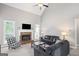 Spacious living room with vaulted ceiling features a brick fireplace and comfortable seating at 68 Timber Creek Estates Dr, Sharpsburg, GA 30277