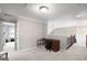 Bright loft area features neutral walls, carpet, and a desk area perfect for a home office or study space at 68 Timber Creek Estates Dr, Sharpsburg, GA 30277