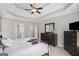 Spacious main bedroom with a tray ceiling, ceiling fan, and generous storage at 68 Timber Creek Estates Dr, Sharpsburg, GA 30277