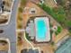 An aerial view of the community pool, playground, and surrounding homes in a residential area at 5760 Winding Lakes Dr, Cumming, GA 30028