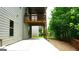 Spacious outdoor patio beneath a deck, offering a private retreat in the backyard at 5760 Winding Lakes Dr, Cumming, GA 30028